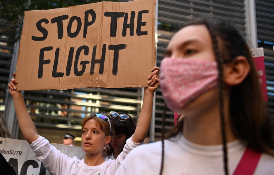 epa10011247 Human rights protesters demonstrate outside the Home Office in London, Britain, 13 June 2022. An Appeal Court judge has ruled against stopping the UK Home Office from flying asylum seekers ...