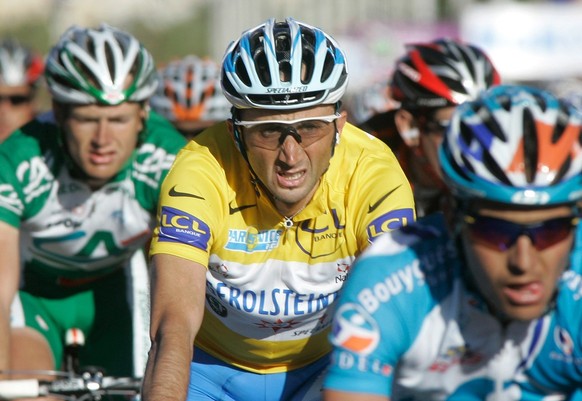 Winner of Paris-Nice cycling race, Davide Rebellin of Italy, center, is seen as he crosses the finish line of the seventh stage, in Nice, southern France, Sunday, March 16, 2008. (AP Photo/Lionel Ciro ...