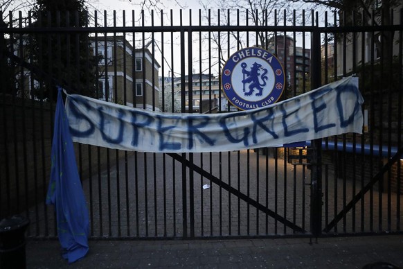 A banner hangs from one of the gates of Stamford Bridge stadium in London where Chelsea fans were protesting against Chelsea&#039;s decision to be included amongst the clubs attempting to form a new E ...