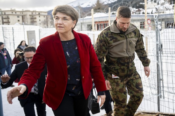 Switzerland&#039;s Defence Minister Viola Amherd, left, goes to inspect a training of Swiss army medical troops in a temporary military hospital in support of the civilian hospital, in case of a large ...