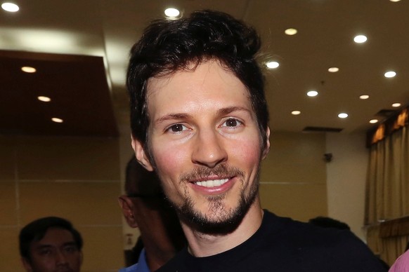 FILE - Telegram co-founder Pavel Durov smiles following his meeting with Indonesian Communication and Information Minister Rudiantara in Jakarta, Indonesia, on Aug. 1, 2017. (AP Photo/Tatan Syuflana,  ...