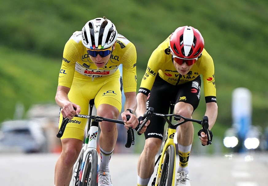 PLATEAU DU MONT-CENIS, FRANCE - JUNE 15: (L-R) Tadej Pogacar of Slovenia and UAE Team Emirates - XRG - Yellow leader jersey and Jonas Vingegaard of Denmark and Team Visma | Lease a Bike compete in the ...