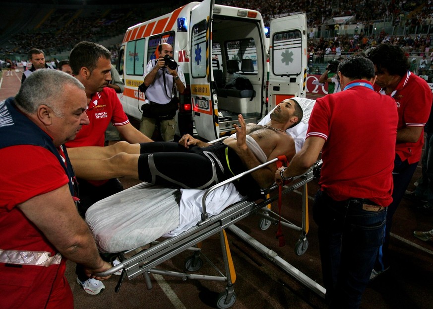 ROME - JULY 13: Salim Sdiri of France is stretchered off after being injured by a wayward javelin that struck him as he competed in the Mens Long Jump, during the IAAF Golden Gala at The Olympic Stadi ...