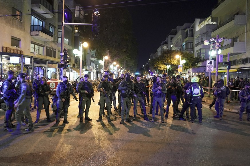 Israeli police block the shooting attack site in Tel Aviv, Israel, Thursday, March 9, 2023. A Palestinian gunman opened fire on a crowded street in central Tel Aviv late Thursday, wounding three peopl ...
