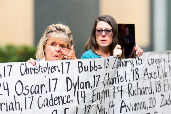 Lori Schott, whose daughter Annalee Schott died at age 18, holds a banner with names of young people who advocates say died as a result of social media outside the Ronald V. Dellums Federal Building a ...