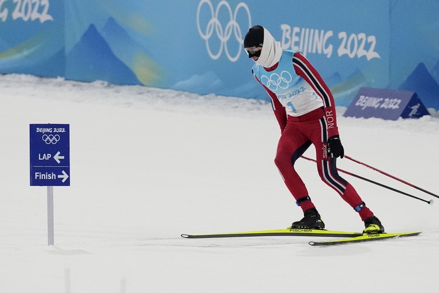 Norway&#039;s Jarl Magnus Riiber turns around after missing a turn during the cross-country skiing portion of the individual Gundersen large hill/10km competition at the 2022 Winter Olympics, Tuesday, ...