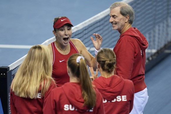 Switzerland&#039;s players Jil Teichmann, Viktorija Golubic, Belinda Bencic and Simona Waltert, from left, celebrates after defeating Australia to win the Billie Jean King Cup tennis finals, at the Em ...