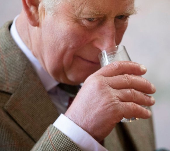 The Prince of Wales, known as the Duke of Rothesay while in Scotland, takes part in a whisky tasting during a visit to the Royal Lochnagar Distillery at Crathie on Royal Deeside. (Photo by Jane Barlow ...