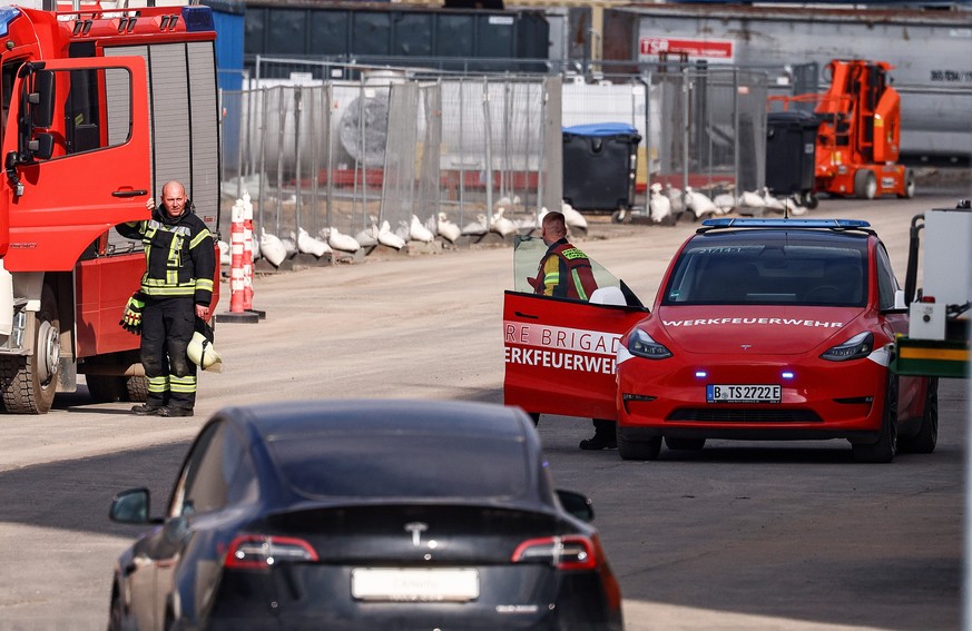 epa11199737 Tesla factory fire brigade checks a plant building at the Tesla Gigafactory in Gruenheide near Berlin, Germany, 05 March 2024. Tesla confirms that production at the Tesla Gigafactory in Gr ...