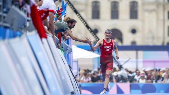Adrien Briffod of Switzerland greets spectators near the finish line during the men&#039;s triathlon competition at the 2024 Paris Summer Olympics in Paris, France, Wednesday, July 31, 2024. (KEYSTONE ...