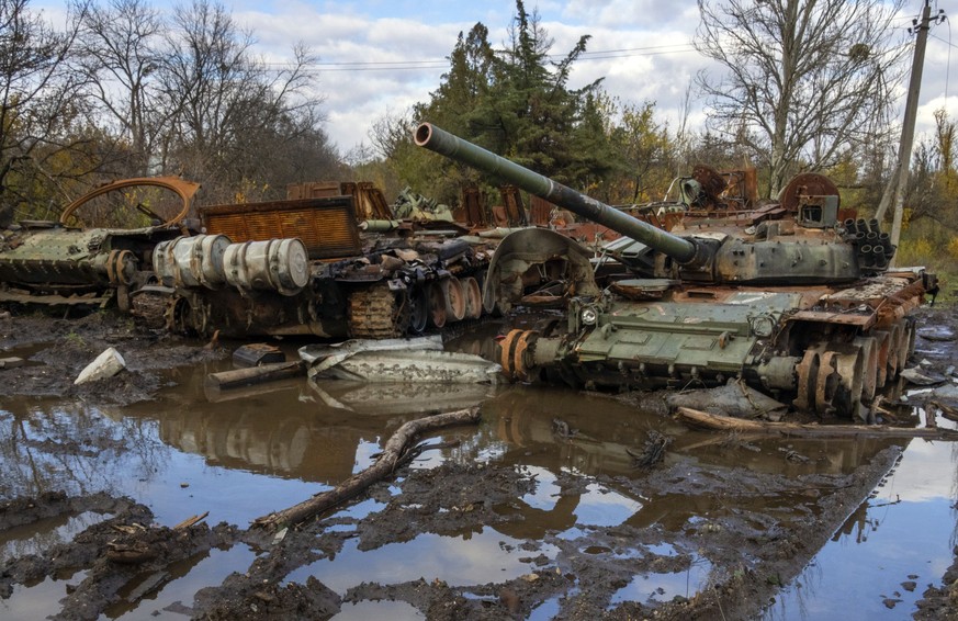 Russian tanks damaged in recent fighting are seen near the recently retaken village of Kamianka, Kharkiv region, Ukraine, Sunday, Oct. 30, 2022.(AP Photo/Efrem Lukatsky)