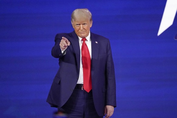 Former president Donald Trump points to cheering supporters as he is introduced before speaking at the Conservative Political Action Conference (CPAC) Sunday, Feb. 28, 2021, in Orlando, Fla. (AP Photo ...