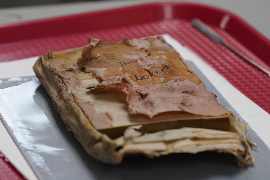 A book that was removed from a time capsule that was removed from the pedestal that once held the statue of Confederate General Robert E. Lee on Monument Ave. Wednesday Dec. 22, 2021, in Richmond, Va. ...