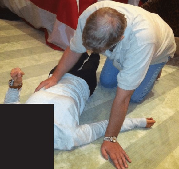 EDS NOTE: GRAPHIC CONTENT - This undated photo, released and redacted by the U.S. Department of Justice as part of the Jeffrey Epstein files, shows Andrew Mountbatten-Windsor, formerly known as Prince ...