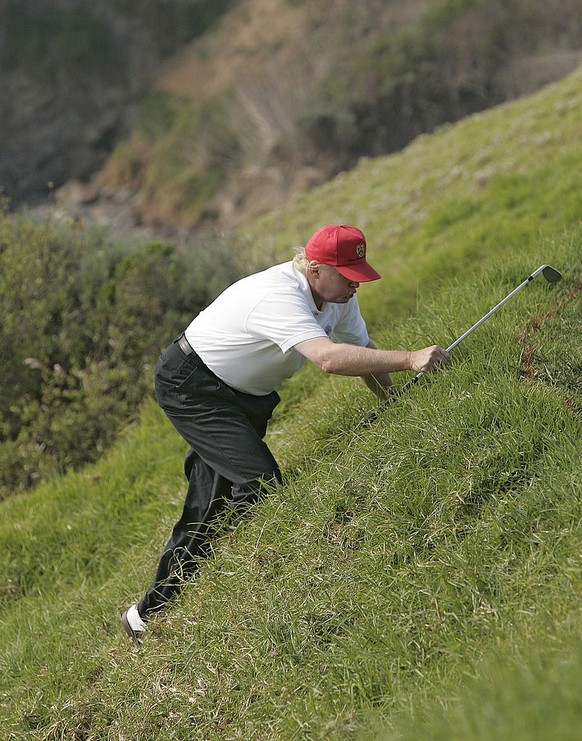 Donald J. Trump blasting a forehand winner from the baseline-with a red, white and blue flag directly over his head. (Photo by Art SEITZ/Gamma-Rapho via Getty Images)