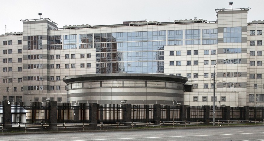 FILE - In this Saturday, July 14, 2018 file photo, a man walks past the building of the Main Directorate of the General Staff of the Armed Forces of Russia, also know as Russian military intelligence  ...