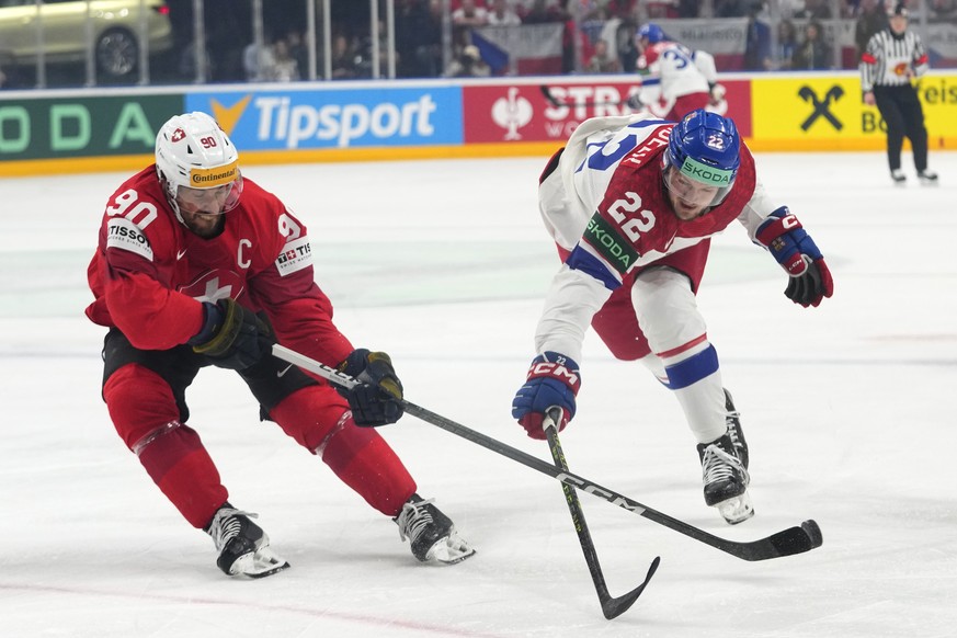 Czech Republic&#039;s Jachym Kondelik, right, challenges Switzerland&#039;s Roman Josi during the preliminary round match between Czech Republic and Switzerland at the Ice Hockey World Championships i ...