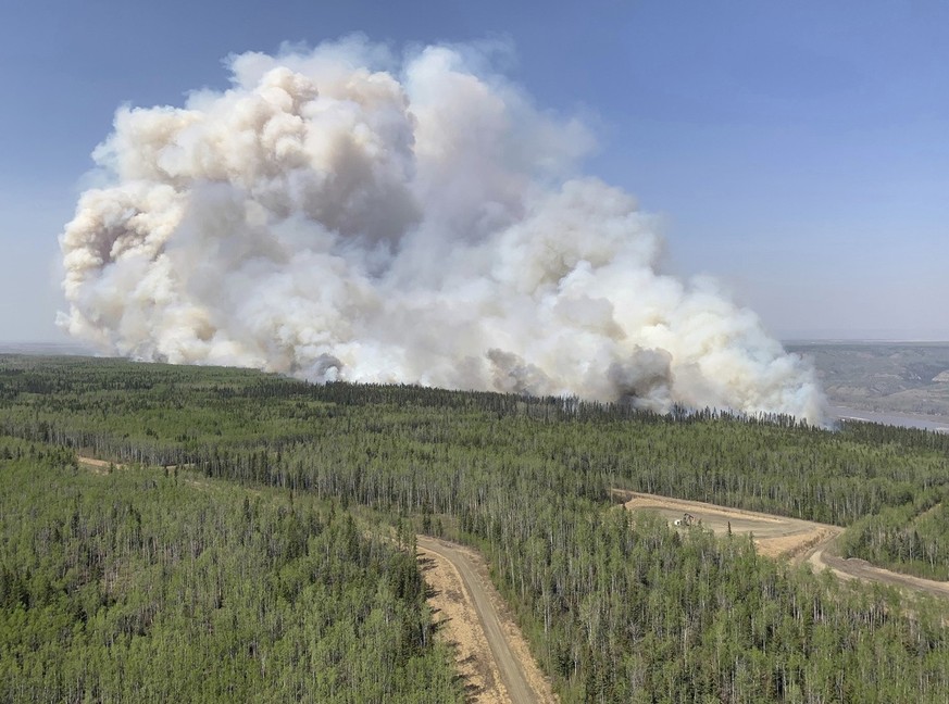 In this photo provided by the Government of Alberta Fire Service, a wildfire burns a section of forest in the Grande Prairie district of Alberta, Canada, Saturday, May 6, 2023. (Government of Alberta  ...