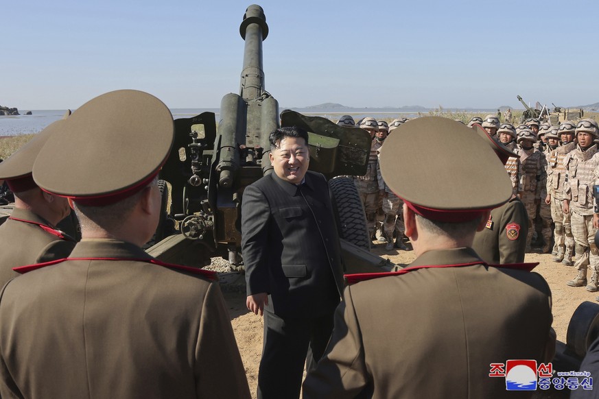 FILE - In this undated photo provided Oct. 6, 2024, by the North Korean government, its leader Kim Jong Un, center, visits an artillery exercise at an undisclosed place in North Korea. Independent jou ...