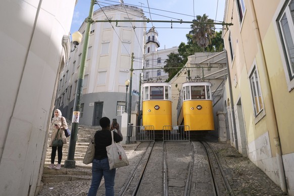 A woman takes photos at out-of-service streetcars parked in Lisbon, Portugal, Thursday, Sept. 4, 2025. (AP Photo/Ana Brigida)
Portugal Streetcar Derailed
