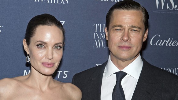 FILE - Angelina Jolie Pitt and Brad Pitt pose for a photo at the WSJ Magazine Innovator Awards 2015 at The Museum of Modern Art in New York, on Nov. 4, 2015. (Photo by Charles Sykes/Invision/AP, File) ...