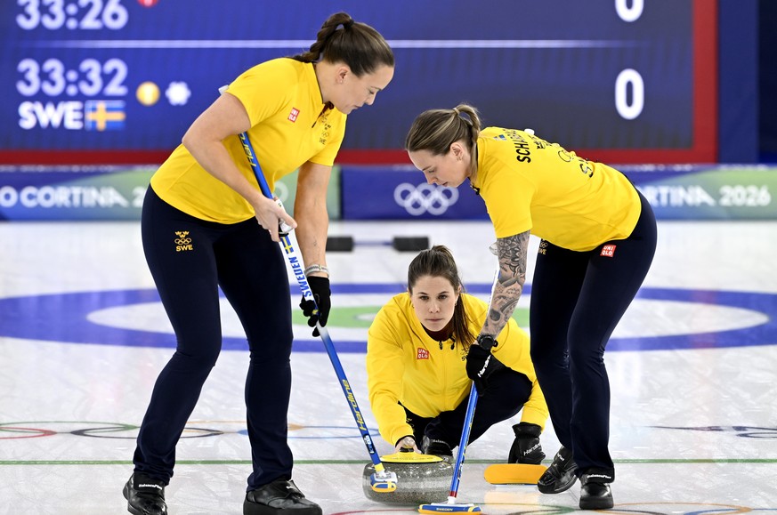 epa12761832 (from L) Agnes Knochenhauer, Anna Hasselborg and Sofia Scharback of Sweden compete during the Women's Curling semi final match between Canada and Sweden at the Milano Cortina 2026 Win ...