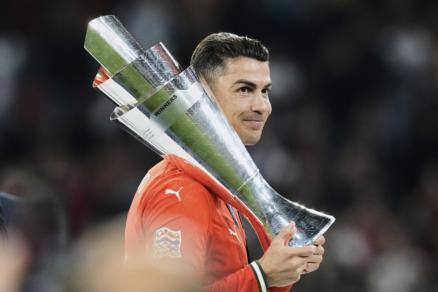 Portugal&#039;s Cristiano Ronaldo holds the trophy after winning the Nations League soccer championship at the Allianz Arena in Munich, Germany, Sunday, June 8, 2025. (AP Photo/Martin Meissner)
Portug ...