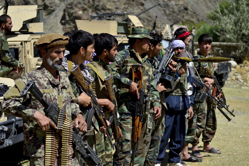 Militiamen loyal to Ahmad Massoud, son of the late Ahmad Shah Massoud, hold their weapons, in Panjshir province northeastern Afghanistan, Thursday, Aug. 26, 2021. The Panjshir Valley is the last regio ...