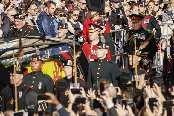 King Charles III walks behind Queen Elizabeth II&#039;s coffin during the procession from the Palace of Holyroodhouse to St Giles&#039; Cathedral, Edinburgh, Monday, Sept. 12, 2022. (Jeff J Mitchell/P ...