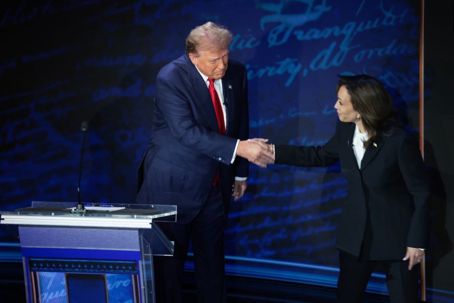 PHILADELPHIA, PENNSYLVANIA - SEPTEMBER 10: Republican presidential nominee, former U.S. President Donald Trump and Democratic presidential nominee, U.S. Vice President Kamala Harris greet as they deba ...