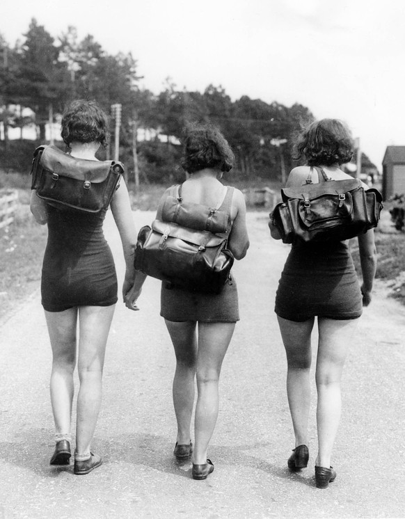 Orig. caption... HOT WEATHER HIKING KIT. 23.7.32. Three fair hikers seen near Lepe, Hampshire, who decided to wear cooler costume than that usually worn by hikers. Note Hikers Backpacking Barefoot Sum ...