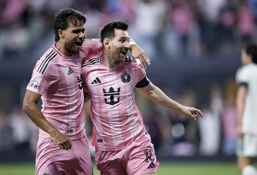 MIAMI, FLORIDA - APRIL 4: Telasco Segovia #8 of Inter Miami CF celebrates with Lionel Messi #10 of Inter Miami CF after Messi scored a goal during first half of the game against Austin FC at Nu Stadiu ...