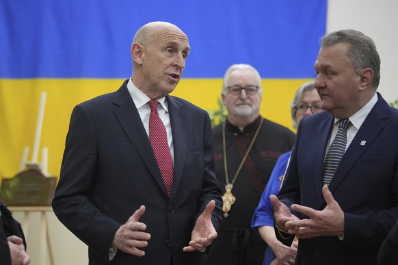 Britain&#039;s Defence Secretary John Healey, left, speaks to members as he visits the Ukrainian Catholic Church in central London, Tuesday, Nov. 19, 2024 to mark the 1000 days since Russia&#039;s inv ...