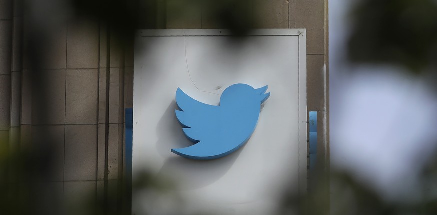 FILE - This July 9, 2019, file photo shows a sign outside of the Twitter office building in San Francisco. Twitter said on late Tuesday, Jan. 3, 2023, that it will ease up on its 3-year-old ban on pol ...