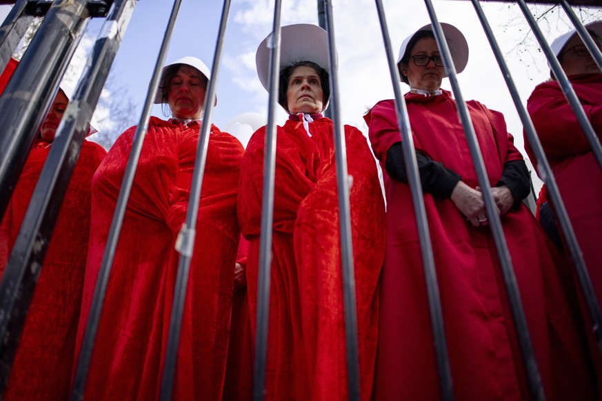 epa10540685 Women&#039;s rights campaigners dressed as characters from the TV show The Handmaid&#039;s Tale protest against the Israeli government&#039;s planned reform of the justice system, during a ...