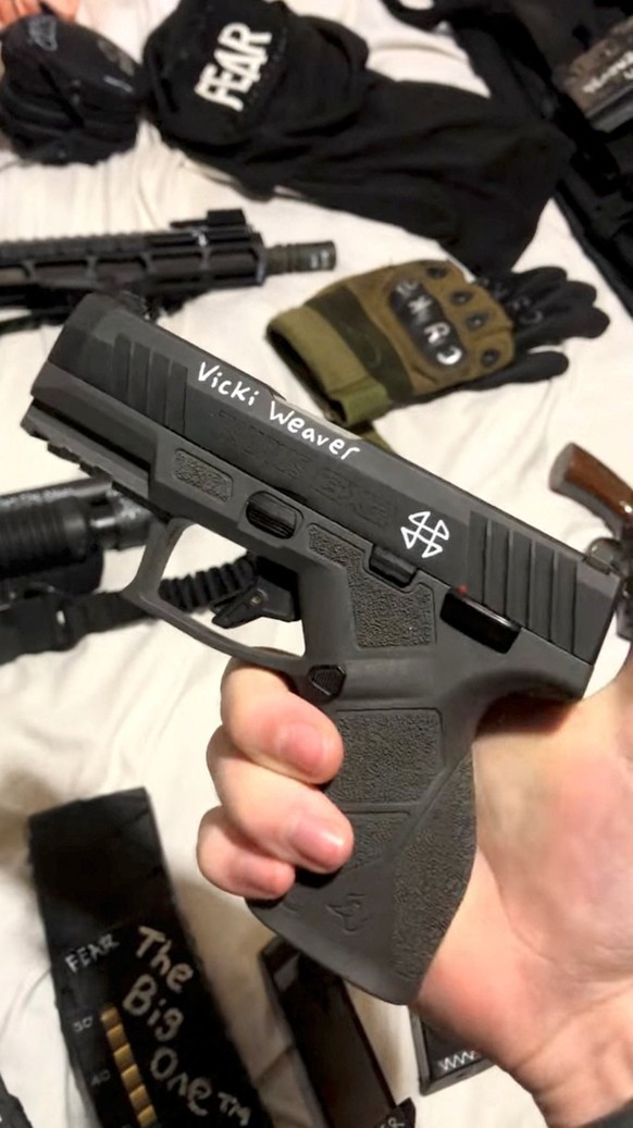A handgun adorned with the name of Vicki Weaver, who was killed at the 1992 Ruby Ridge standoff by an FBI sniper, is held by Robin Westman, identified by a law enforcement source as the suspected shoo ...