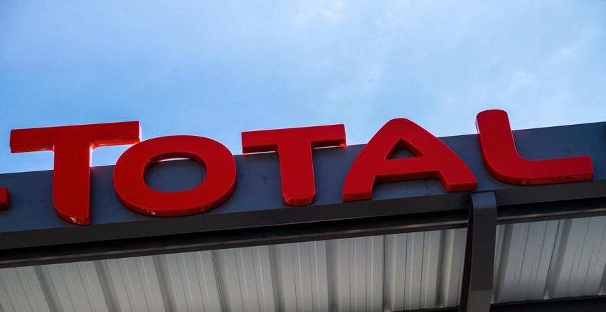 epa09004837 Generic view of the logo of French Energy Group Total during a press visit of a compressed gas service station at the port of Gennevilliers, near Paris, France, 11 February 2021. Vehicles  ...