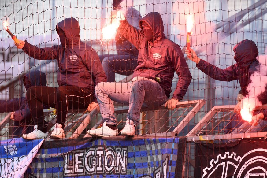 GC&#039;s fans fire flares during the Super League soccer match of Swiss Championship between FC Lausanne-Sport, LS, and Grasshopper Club Zuerich, GC, at the Stade Olympique de la Pontaise stadium, in ...