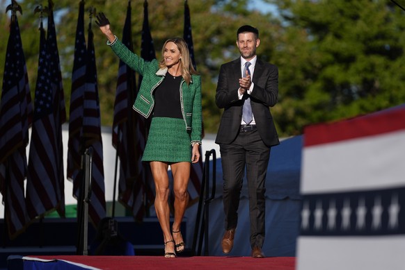 Eric Trump and Republican National Committee co-chair Lara Trump arrive at a campaign rally for Republican presidential nominee former President Donald Trump at the Butler Farm Show, Saturday, Oct. 5, ...