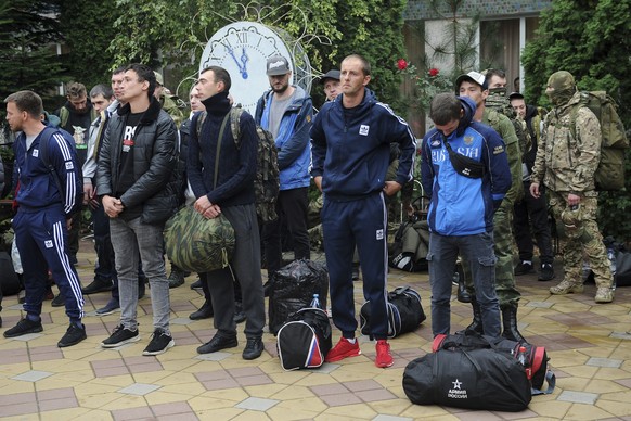Russian recruits gather outside a military recruitment center of Bataysk, Rostov-on-Don region, south of Russia, Monday, Sept. 26, 2022. Russian President Vladimir Putin last Wednesday ordered a parti ...