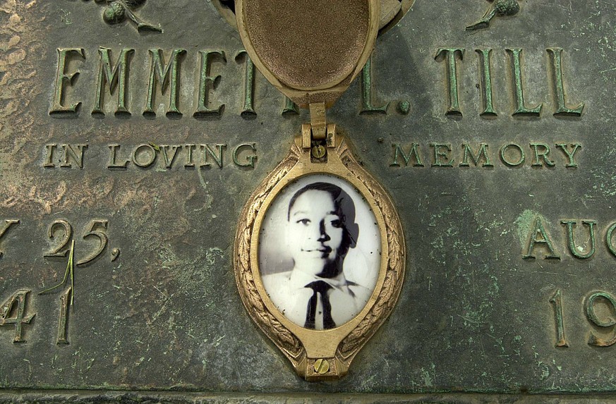 FILE - In this May 4, 2005 file photo, Emmett Till&#039;s photo is seen on his grave marker in Alsip, Ill. Legislation that would make lynching a federal hate crime in the U.S. is expected to be signe ...