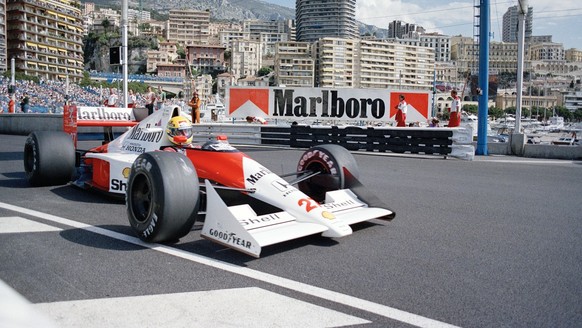 Ayrton Senna of Brazil drives his McLaren-Honda Formula One car at the swimming pool curve during the final trial session of the 48th Monaco Grand Prix, May 24, 1990. Senna shattered the lap record to ...