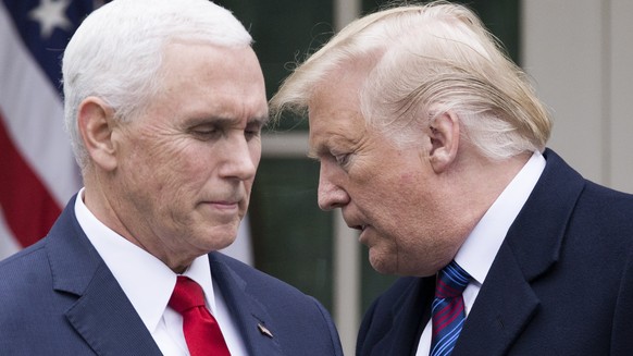 epa08931300 (FILE) - US President Donald J. Trump (R) turns over the podium to US Vice President Mike Pence (L) during a news conference in the Rose Garden of the White House in Washington, DC, USA, 0 ...