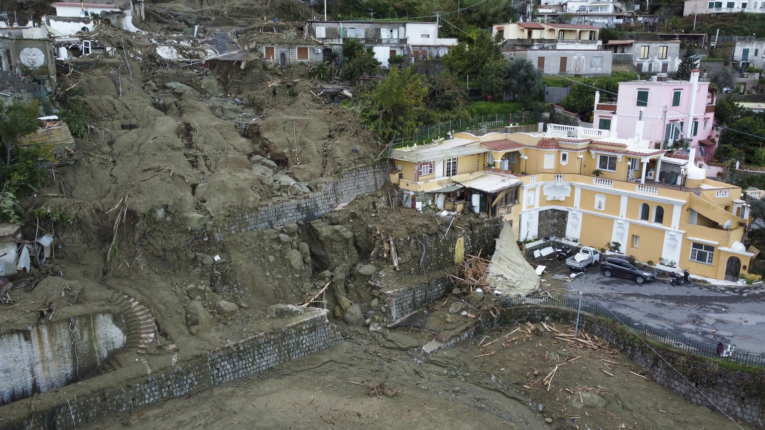 An aerial view of damaged houses after heavy rainfall triggered landslides that collapsed buildings and left as many as 12 people missing, in Casamicciola, on the southern Italian island of Ischia, Su ...