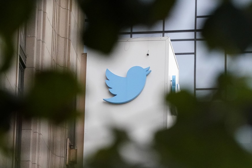 FILE - A sign at Twitter headquarters is shown in San Francisco, Dec. 8, 2022. Twitter says it has removed thousands of tweets showing a poster promoting a ?trans day of vengeance? protest in support  ...