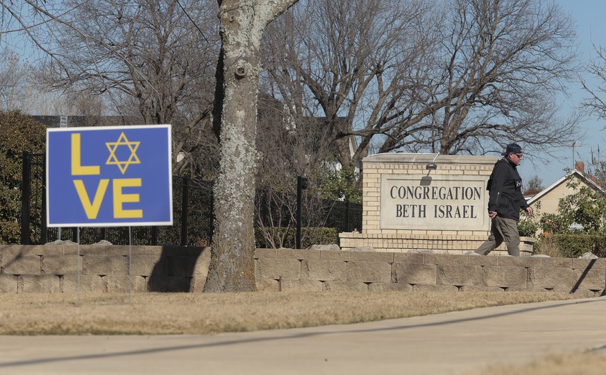 epa09689871 Law enforcement personnel continue the investigation to the hostage incident at Congregation Beth Israel Synagogue in Colleyville, Texas, USA, 16 January 2022. Four hostages were held by a ...