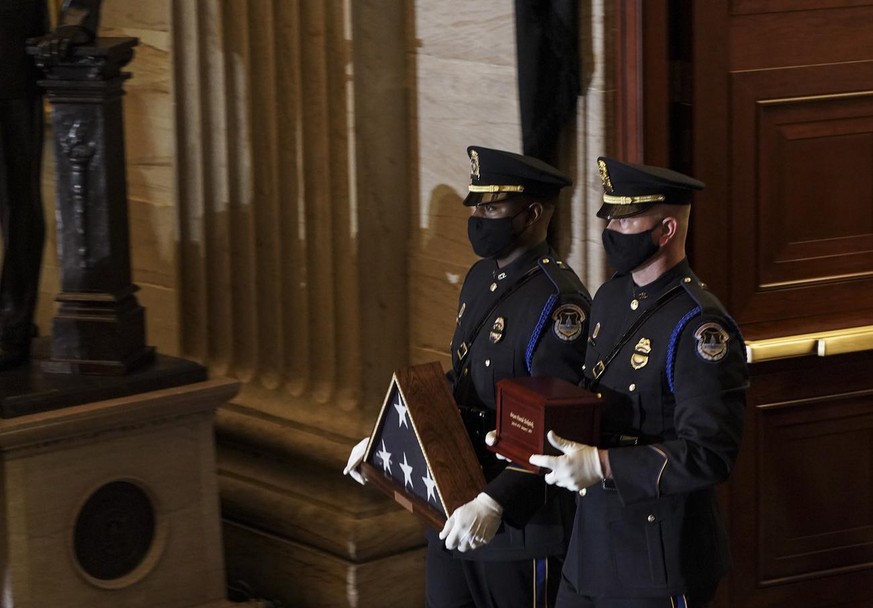 epa08982968 US Capitol Police Officers carry the remains of fellow officer Brian Sicknick before the lying-in-honor ceremony at the Capitol, in Washington DC, USA, 02 February 2021. Officer Sicknick w ...