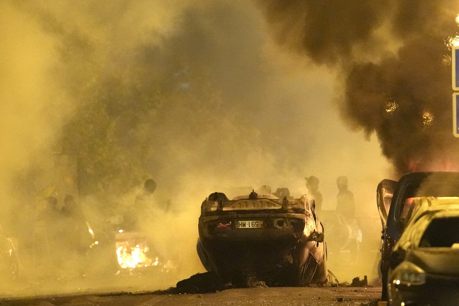 Youths clash with Police forces as cars burn in Nanterre, outside Paris, Thursday, June 29, 2023. The death of 17-year-old Nael by police during a traffic check Tuesday in the Paris suburb of Nanterre ...