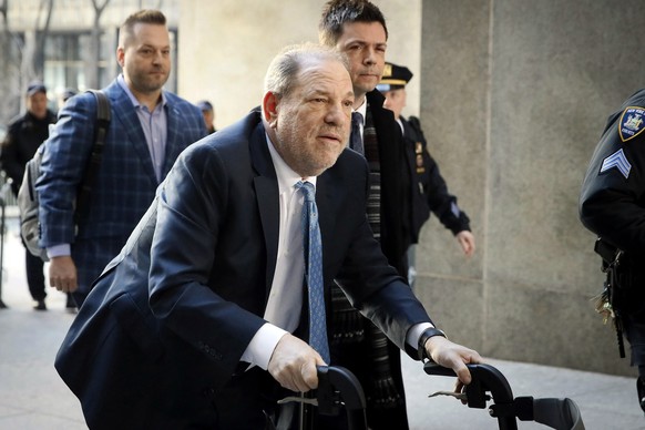 FILE - Harvey Weinstein arrives at a Manhattan courthouse as jury deliberations continue in his rape trial in New York, Feb. 24, 2020. New York&#039;s highest court has agreed to hear an appeal from W ...