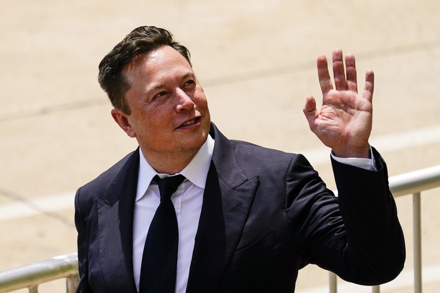 FILE - CEO Elon Musk departs from the justice center in Wilmington, Del., Tuesday, July 13, 2021. Musk says his planned $44 billion purchase of Twitter is &quot;temporarily on hold&quot; pending detai ...